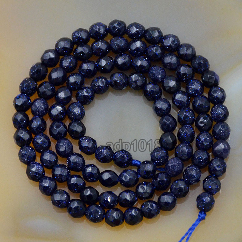 Faceted Natural Blue Sandstone Gemstone Round Loose Beads on a