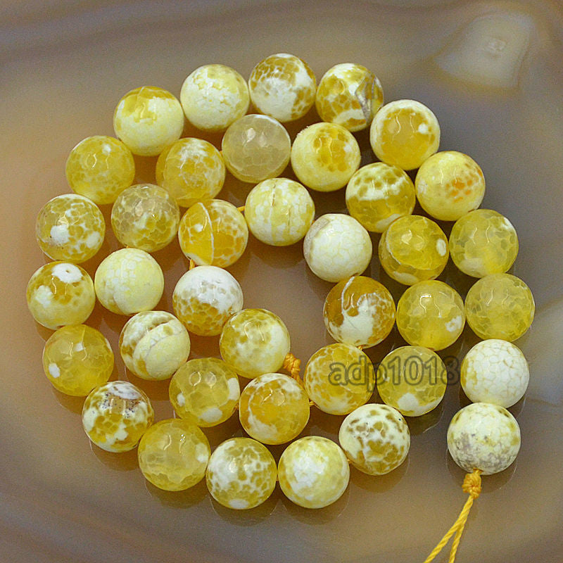 Faceted Natural Red Fire Agate Gemstone Round Loose Beads on a